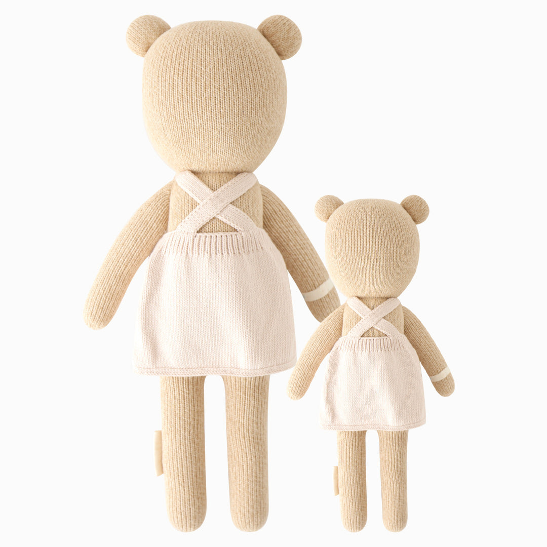 Cuddle and kind stuffed doll Goldie the honey bear in the regular and little sizes, shown from the back.