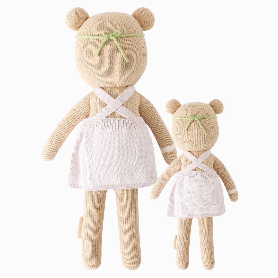 Cuddle and kind stuffed doll Olivia the honey bear in the regular and little sizes, shown from the back.