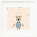 An inspirational print with a graphic of Charlie the honey bear on a blush background with a bumblebee print and the words “Home is wherever I’m with you” in black, whimsical font.
