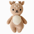 A cuddle and kind doll from the baby animal collection, baby fawn, shown from the front. Baby fawn is brown with a white tummy, little white dots on their head and teensy antlers.