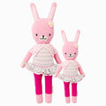 Chloe the bunny in the regular and little sizes, shown from the front. Chloe is pink, and she is wearing a gray and white striped dress and pink short-sleeved cardigan.