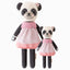 Polly the panda in the regular and little sizes, shown from the front. Polly is wearing a colorblock dress and has a hand-knit flower on her ear.