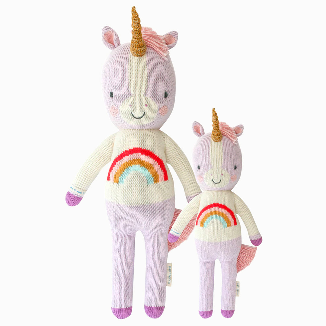 Zoe the unicorn in the regular and little sizes, shown from the front. Zoe is purple, and her shirt has a rainbow on it.