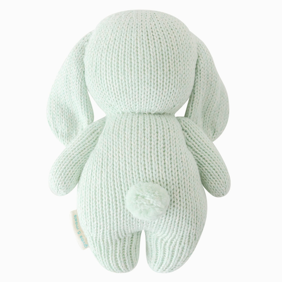 The bunny doll shown from the back. Baby bunny in mint has a fluffy, cotton tail. 