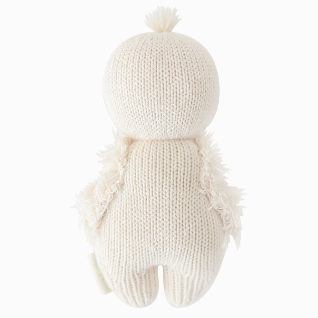 The baby gosling doll shown from the back.