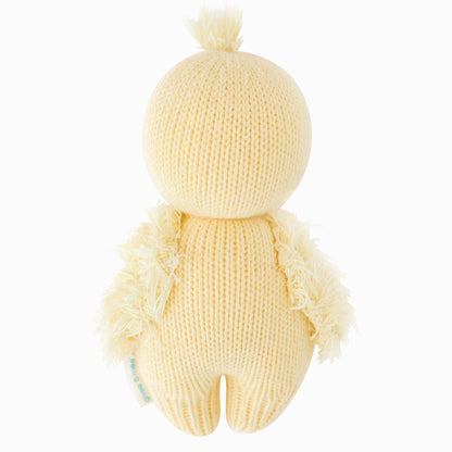 The baby duckling doll shown from the back.