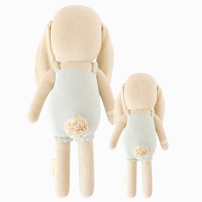 Cuddle and kind doll Briar the bunny in the regular and little sizes, shown from the back. Briar has a fluffy pom pom tail in white and confetti colors.