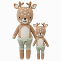 Elliott the fawn in the regular and little sizes, shown from the front. Elliott is wearing green shorts with a bow.