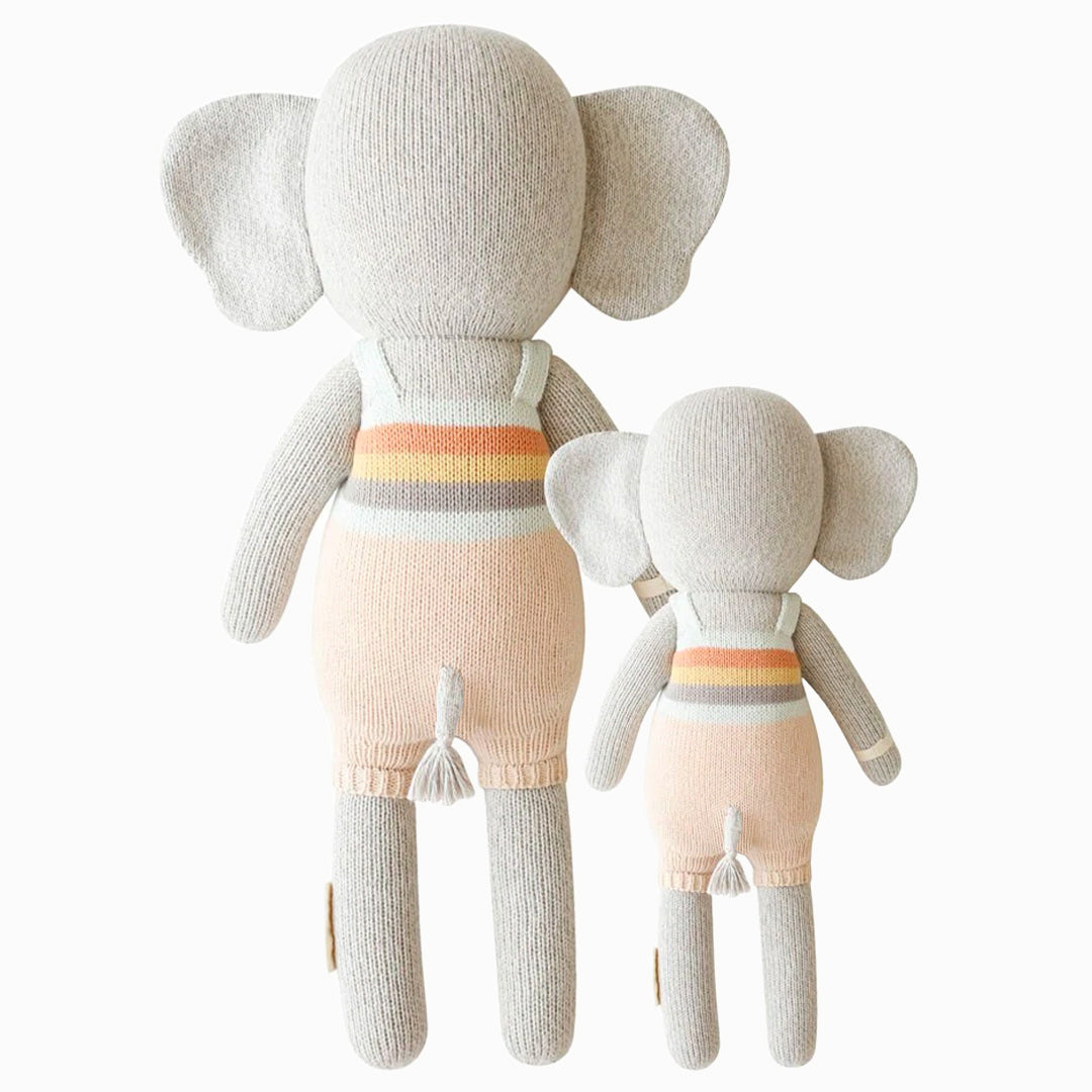 Cuddle and kind doll Evan the elephant in the regular and little sizes, shown from the back. Evan’s tail is poking out the back of his overalls and has a tassel on the end.