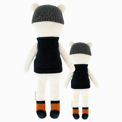 Cuddle and kind doll Hudson the polar bear in the regular and little sizes, shown from the back.