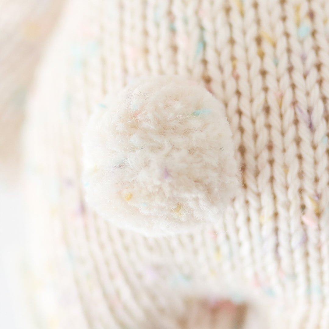 A close up showing baby bunny in confetti’s fluffy cotton tail.