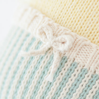 A close-up showing the hand-knit details on Finley the duckling’s swim trunks.