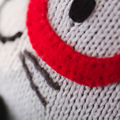 A close-up showing hand-knit details on Benedict the bunny’s face.