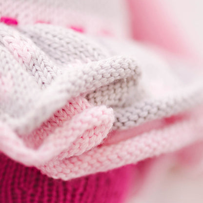 A close-up showing the hand-knit peplum detail on Chloe the bunny's dress.