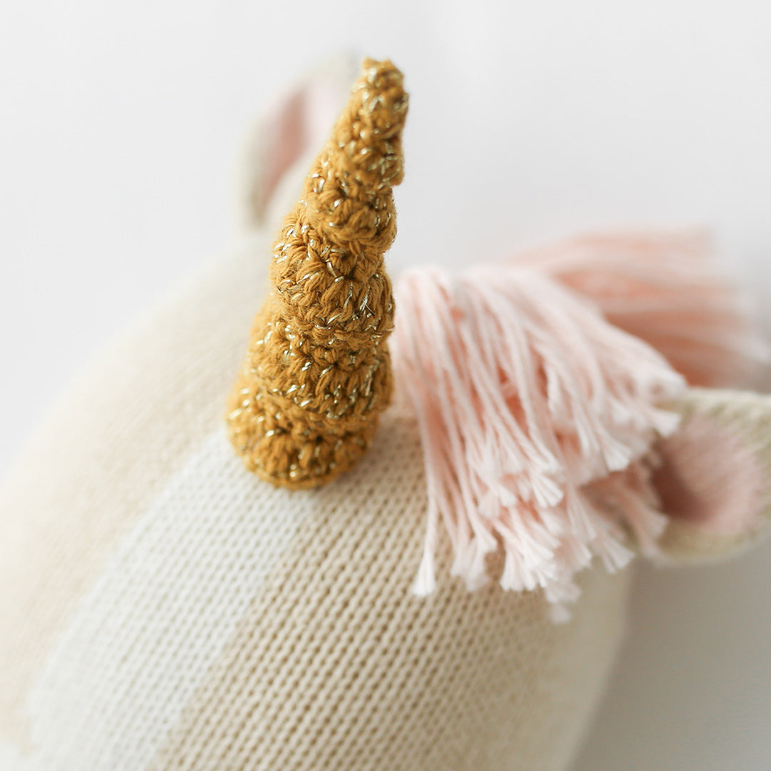 A close-up showing the knit detail on Zara the unicorn's sparkly horn.