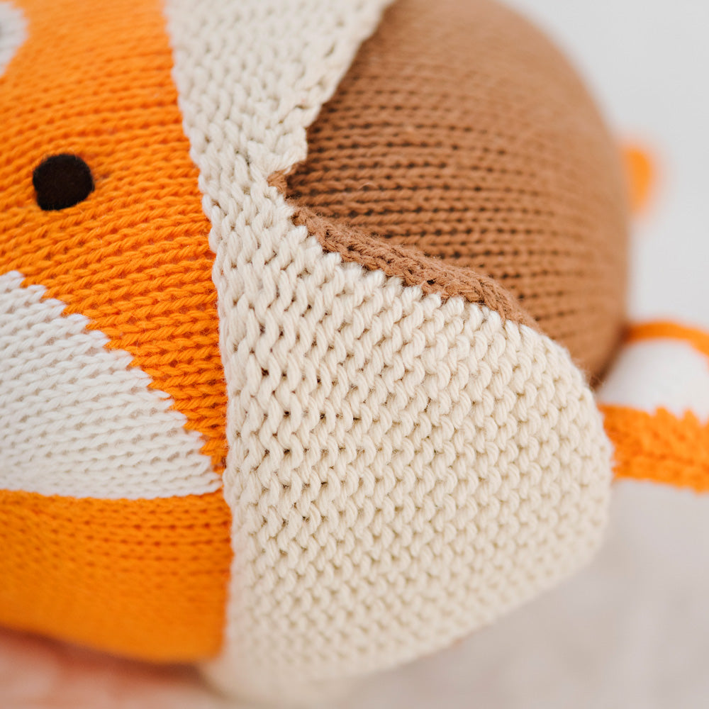 A close-up showing the unique, hand-knit details on Wyatt the fox’s hat.