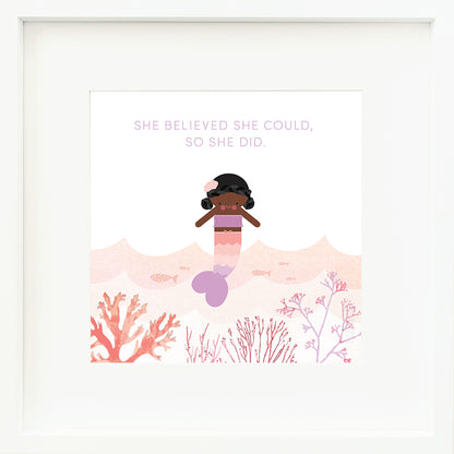 A framed print with a drawing of Maya the mermaid and text that says “She believed she could, so she did.”