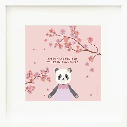 A framed print with a drawing of Polly the panda, with text that says "Believe you can, and you’re halfway there."