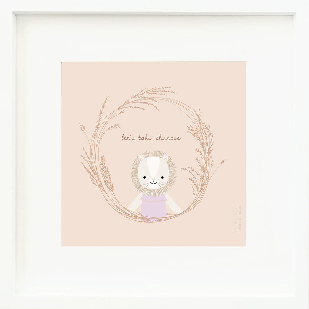 An inspirational print with a graphic of Savannah the lion inside a ring of grass with the words “Let’s take chances” in brown on a blush-colored background.