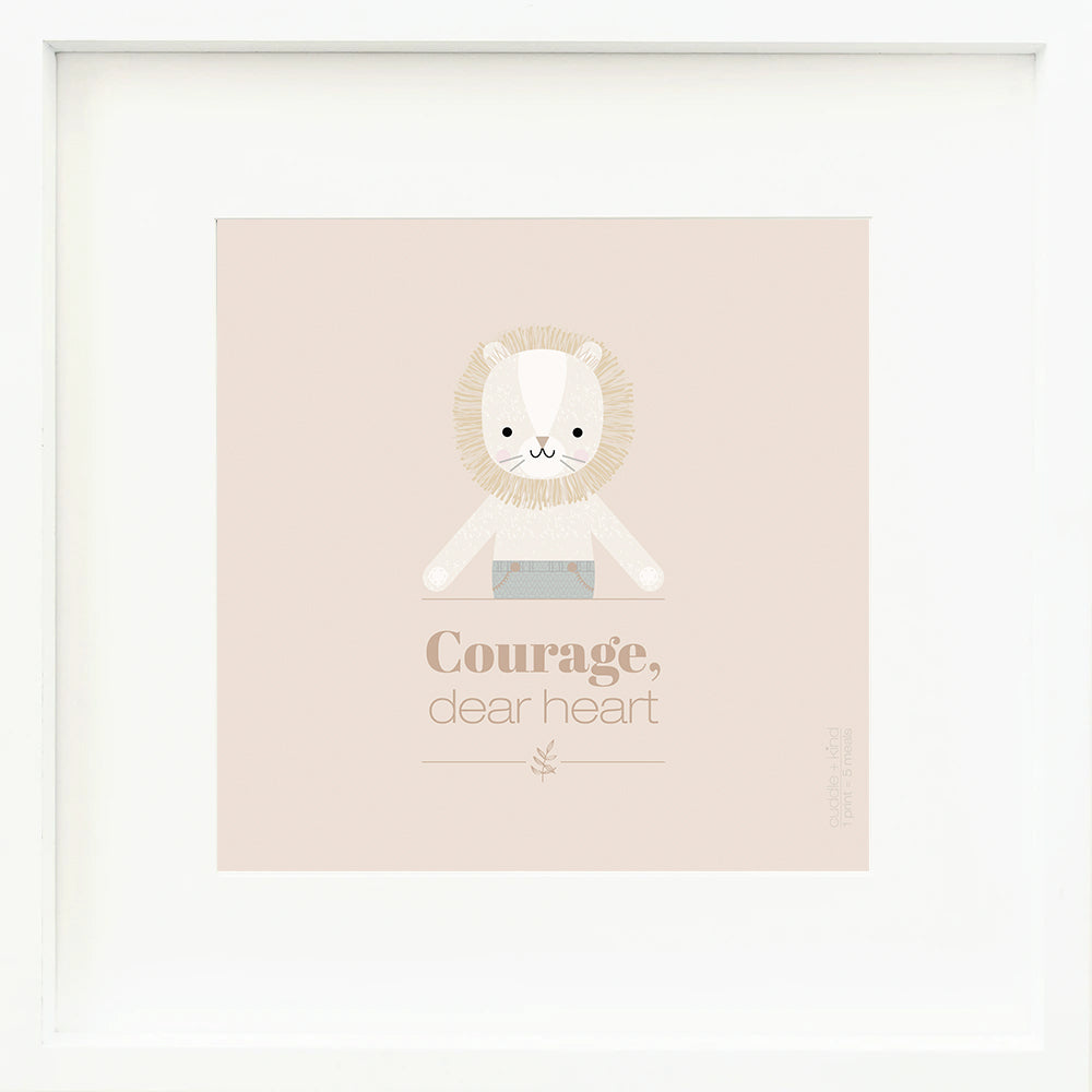 A framed print with a drawing of Sawyer the lion and text that says “Courage, dear heart.”