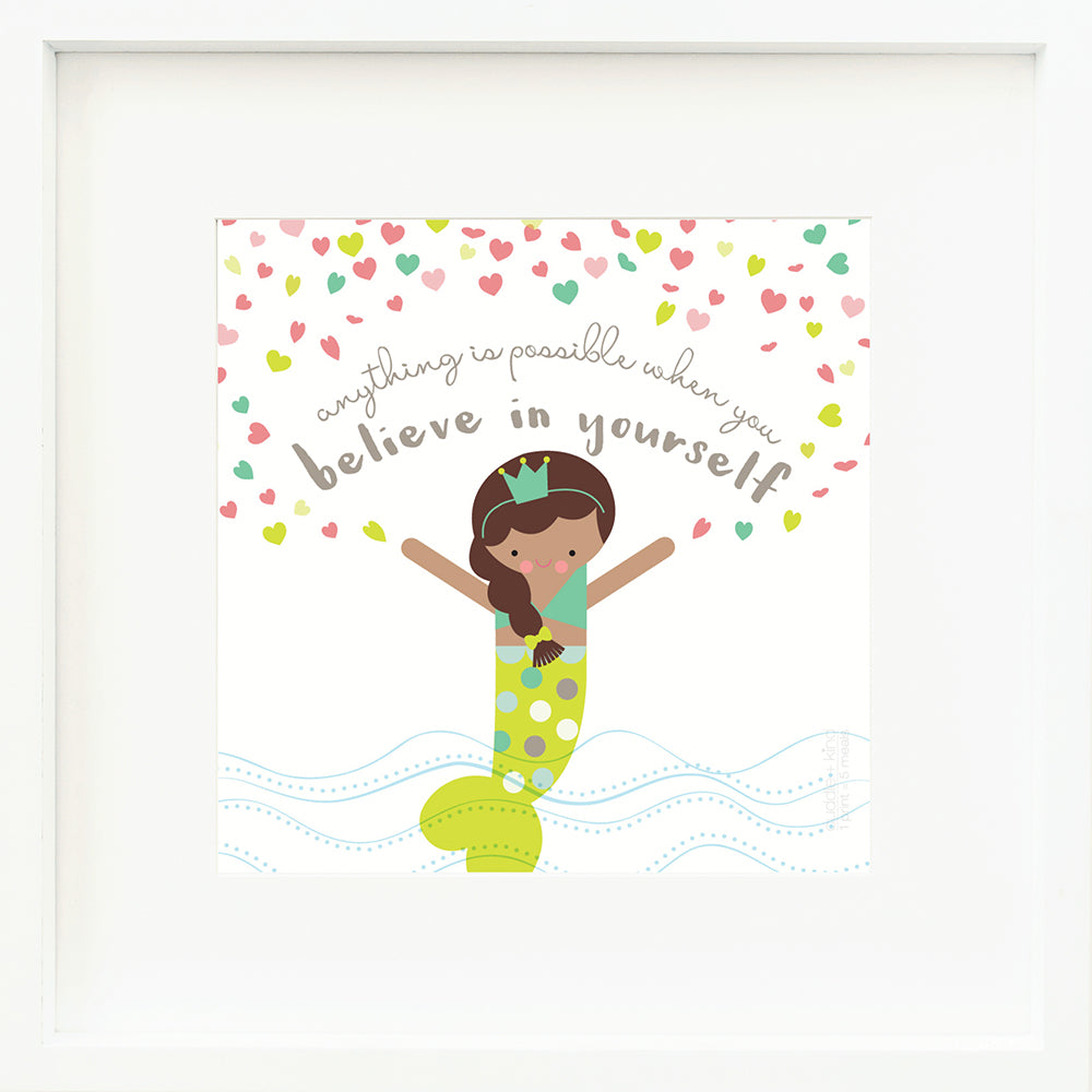 A framed print with a drawing of Pearl the mermaid and text that says “Anything is possible when you believe in yourself.”