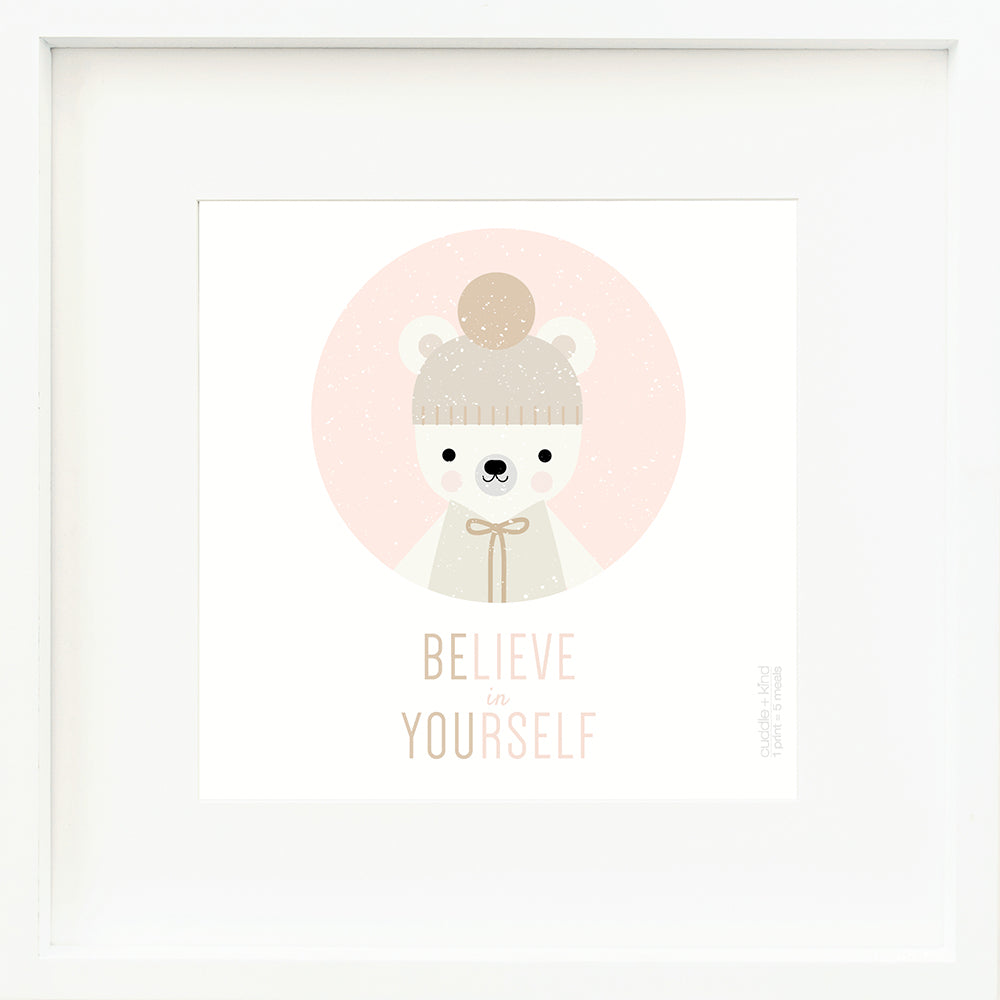 A framed print with a drawing of Hudson the polar bear and text that says “Believe in yourself.”