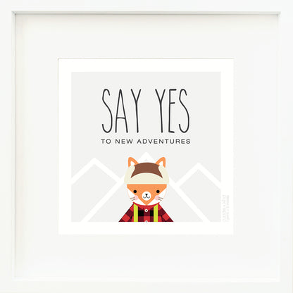 A framed print with a drawing of Wyatt the fox and text that says “Say yes to new adventures.”