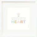 An inspirational print with a graphic of Avery the lamb on a white background with the words “Sometimes the smallest things take up the most room in your heart” in gray, with the word “heart” in rainbow block letters.