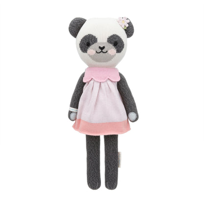 Polly the panda shown from 360°. Polly is wearing a colorblock dress and has a hand-knit flower on her ear.