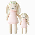 Hannah the bunny in the regular and little sizes, shown from the front. Hannah is wearing a blush pink dress and a daisy headband.