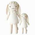 Hannah the bunny in the regular and little sizes, shown from the front. Hannah is wearing an ivory dress and a daisy headband.