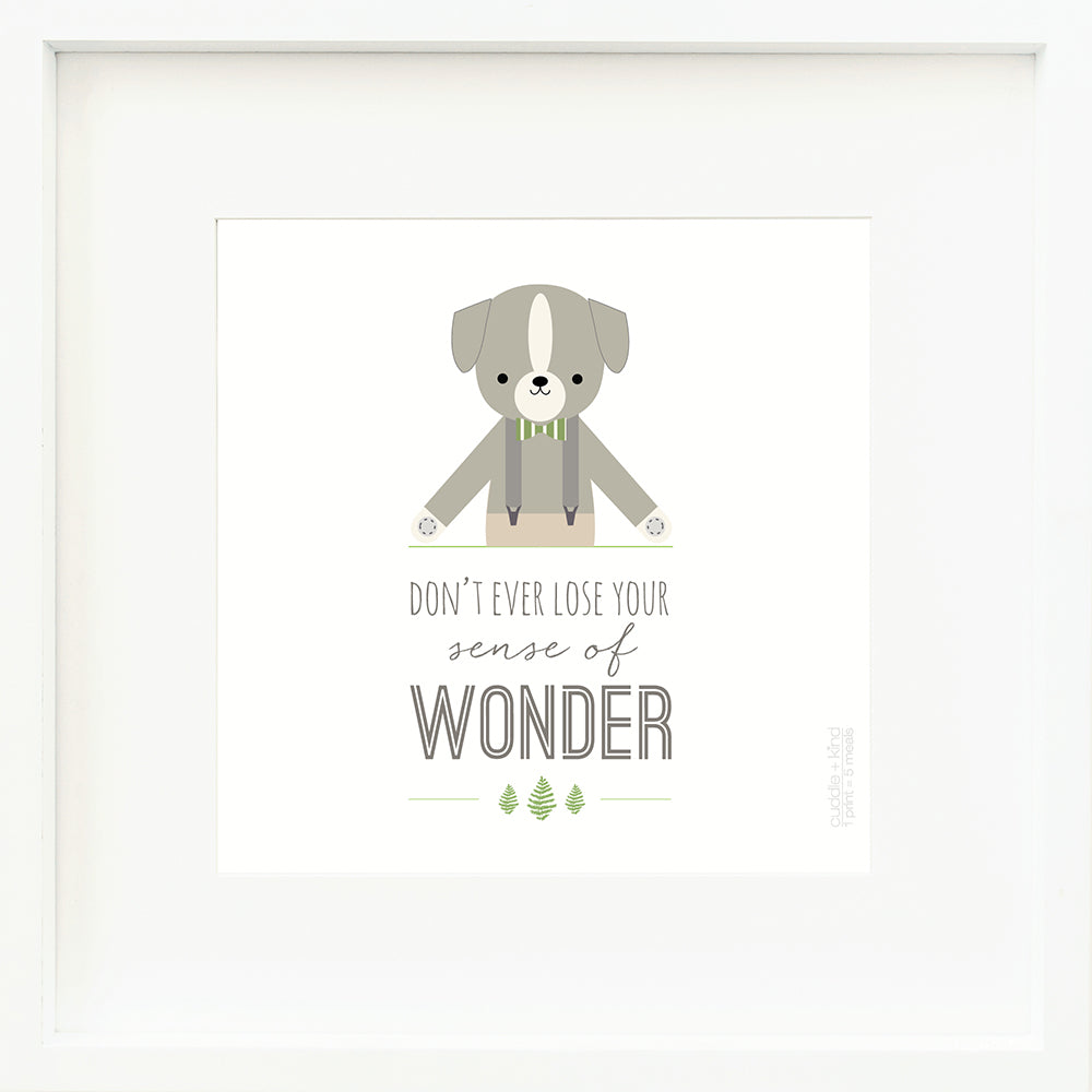 An inspirational print with a graphic of Noah the dog on a white background with the words “Don’t ever lose your sense of wonder” in gray.