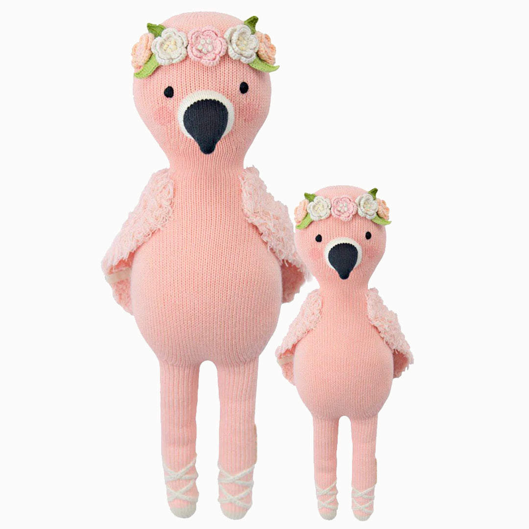 Penelope the flamingo in the regular and little sizes, shown from the front. Penelope has a flower crown, fluffy wings and ballet slippers.