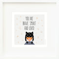 An inspirational print with a graphic of Sadie the fox on a gray background with gold star, circle and triangle accents and the words “You are brave, smart and loved” in black.
