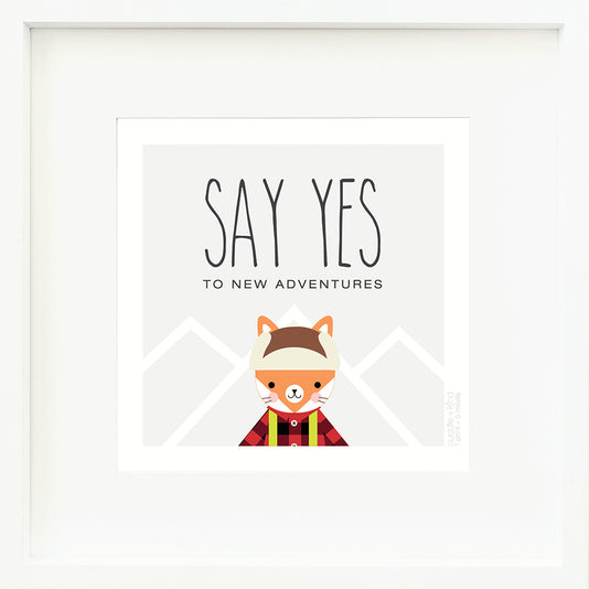 An inspirational print with a graphic of Wyatt the fox on a gray background with mountain peaks outlined in white and the words “Say yes to new adventures” in black.